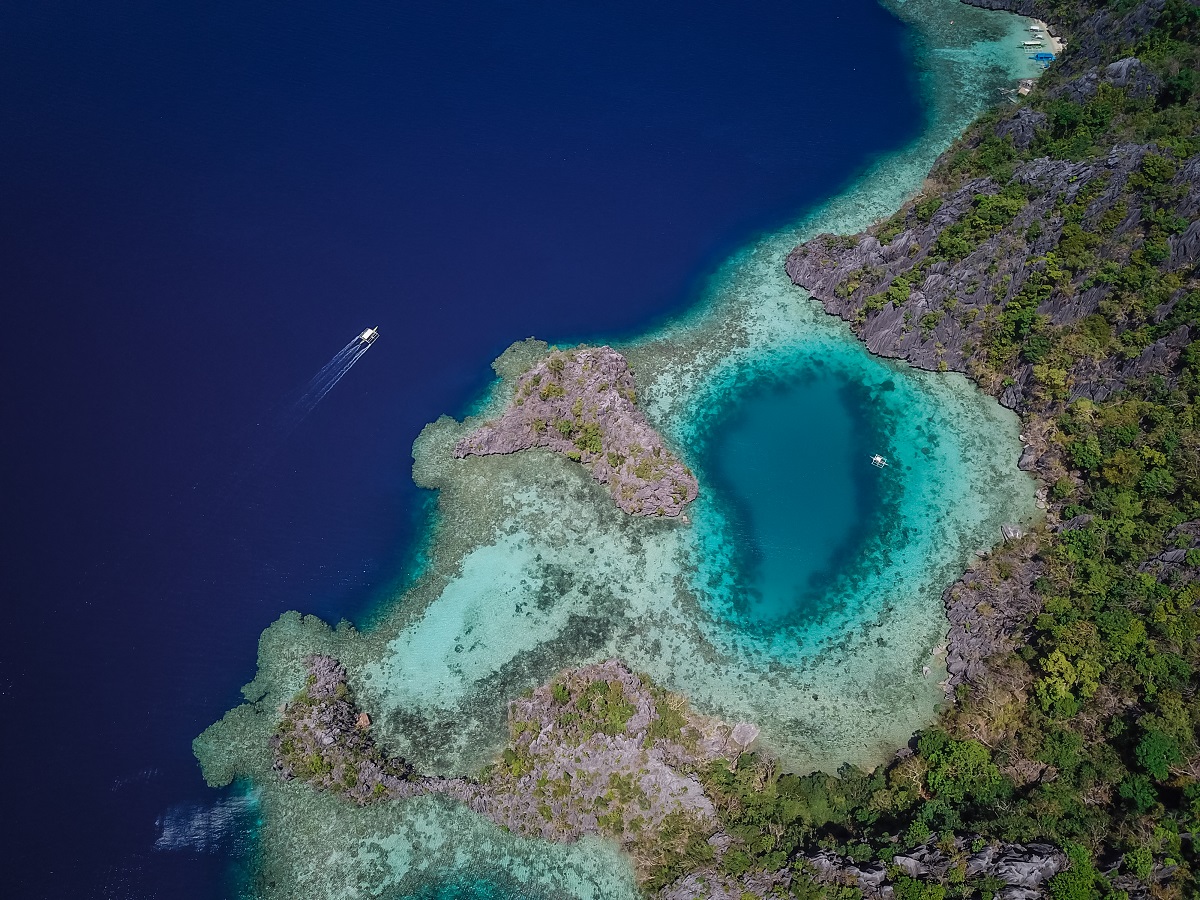 Aerial image of a blue lagoon off of Coron Island